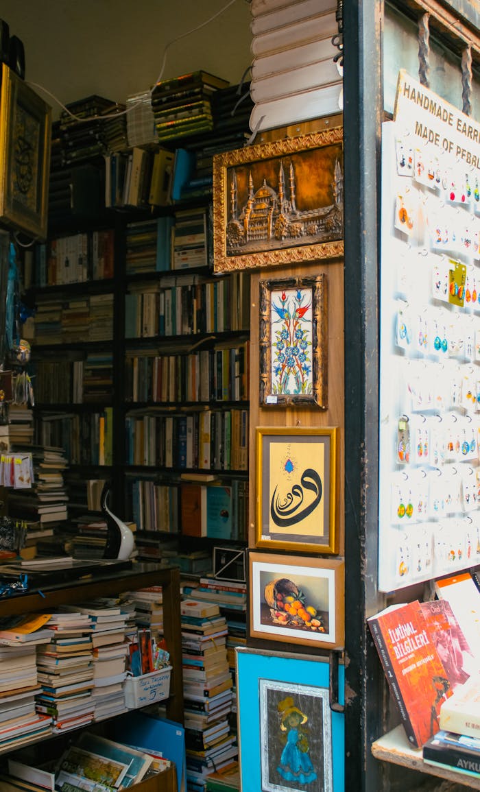 Vintage bookshop interior with books, art pieces, and handmade earrings creating a cozy ambiance.